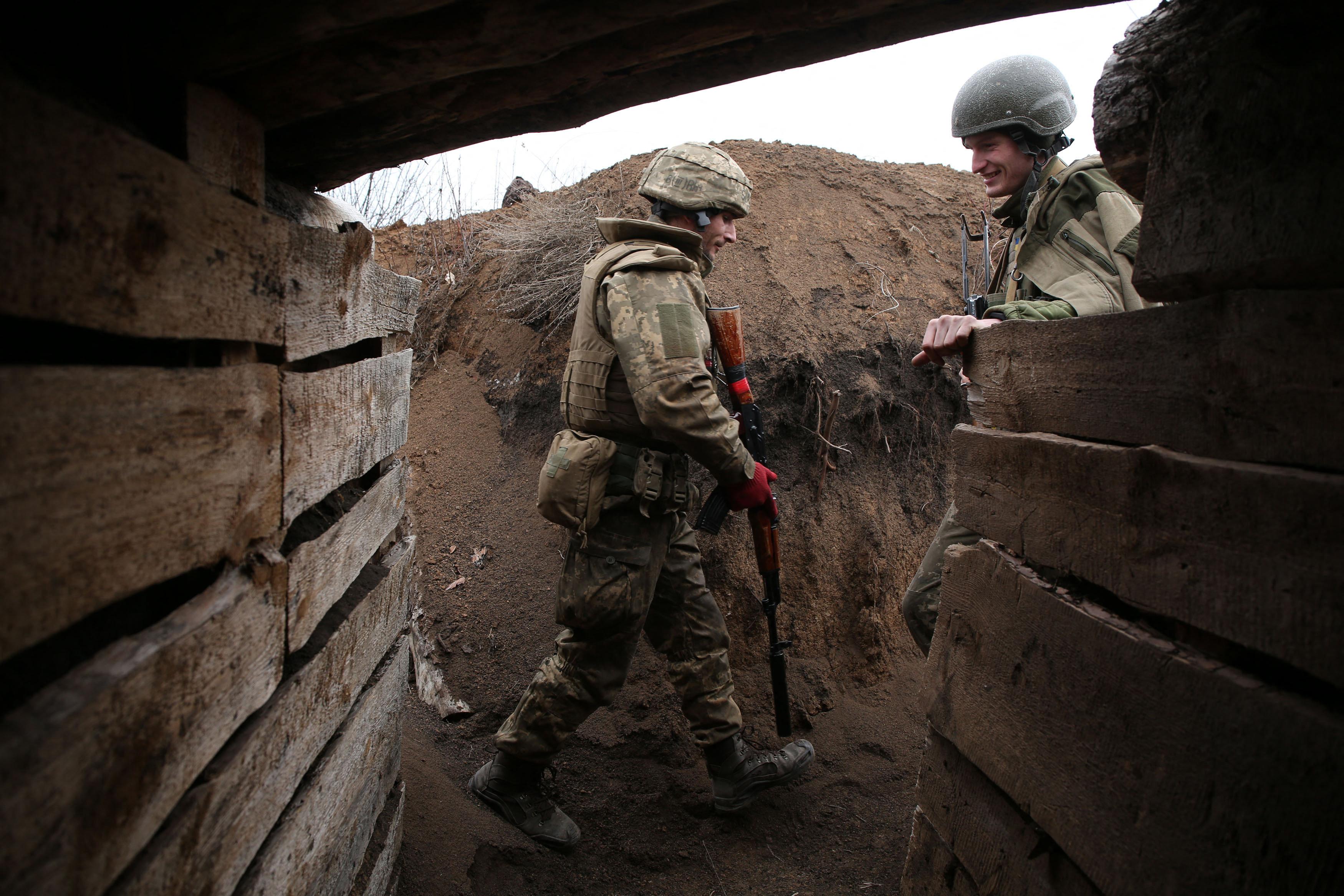 Ukrainian soldiers in a trench on the front lines facing Russian-backed separatists near the town of Zolote april 2021